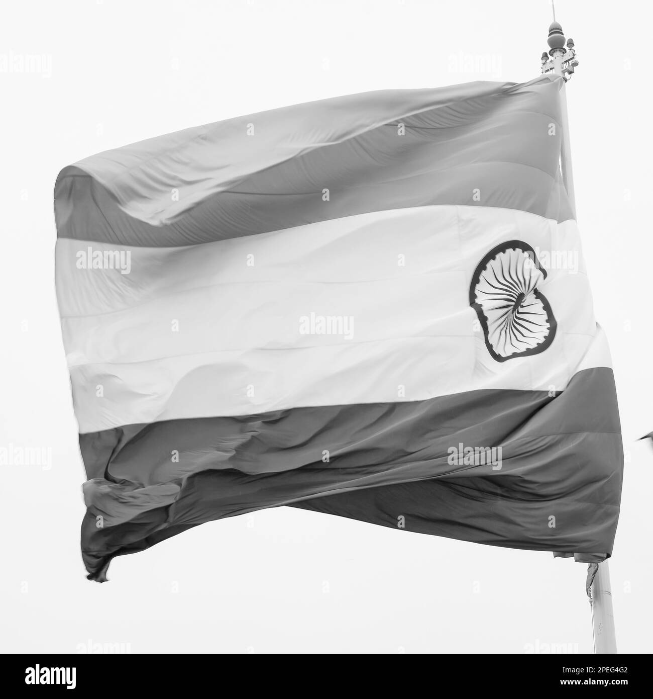 India flag flying high at Connaught Place with pride in blue sky, India