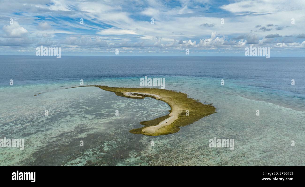 Islet on a coral reef. Atoll in the sea. Tun Sakaran Marine Park. Borneo, Sabah, Malaysia. Stock Photo