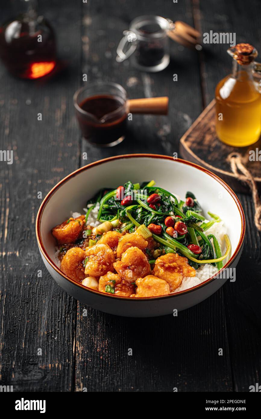 Asian rice dish with shrimp and spinach Stock Photo - Alamy