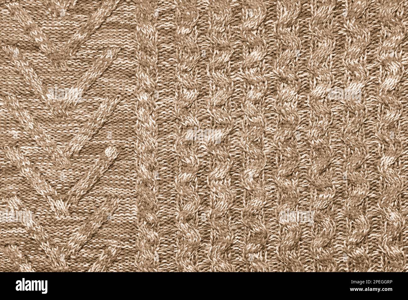 brown knitted fabric with large knitting needles Stock Photo