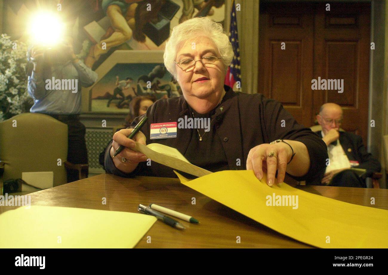 Republican elector Carolyn McDowell, of Jefferson City, Mo., casts her