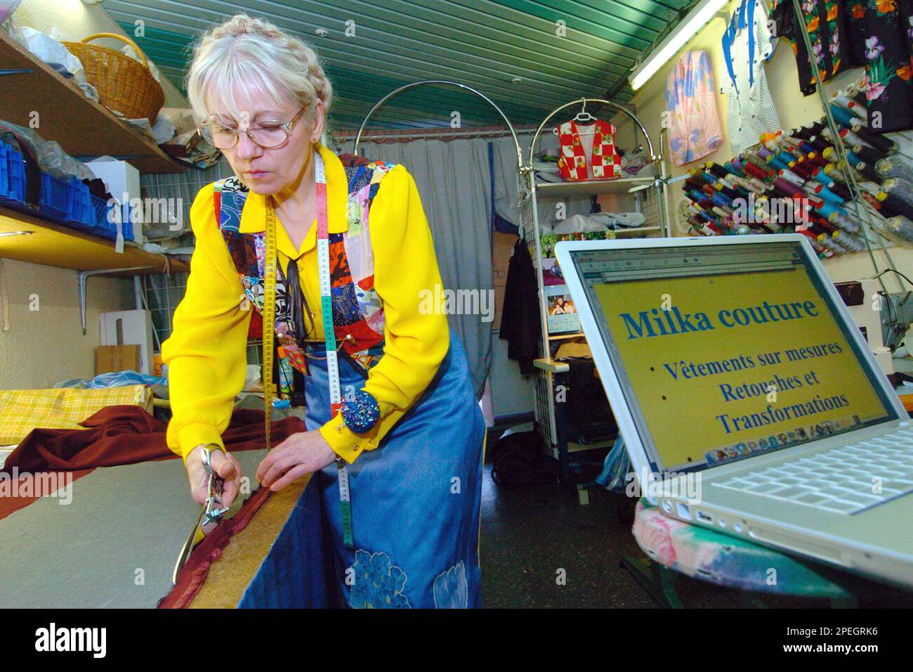 Milka Budimir, works in her couture shop, in Bourg Les Valences, southern  France, Tuesday Dec.14, 2004. Budimir is expected to defend next Jan. 31  her web site www.milka.fr against the American food