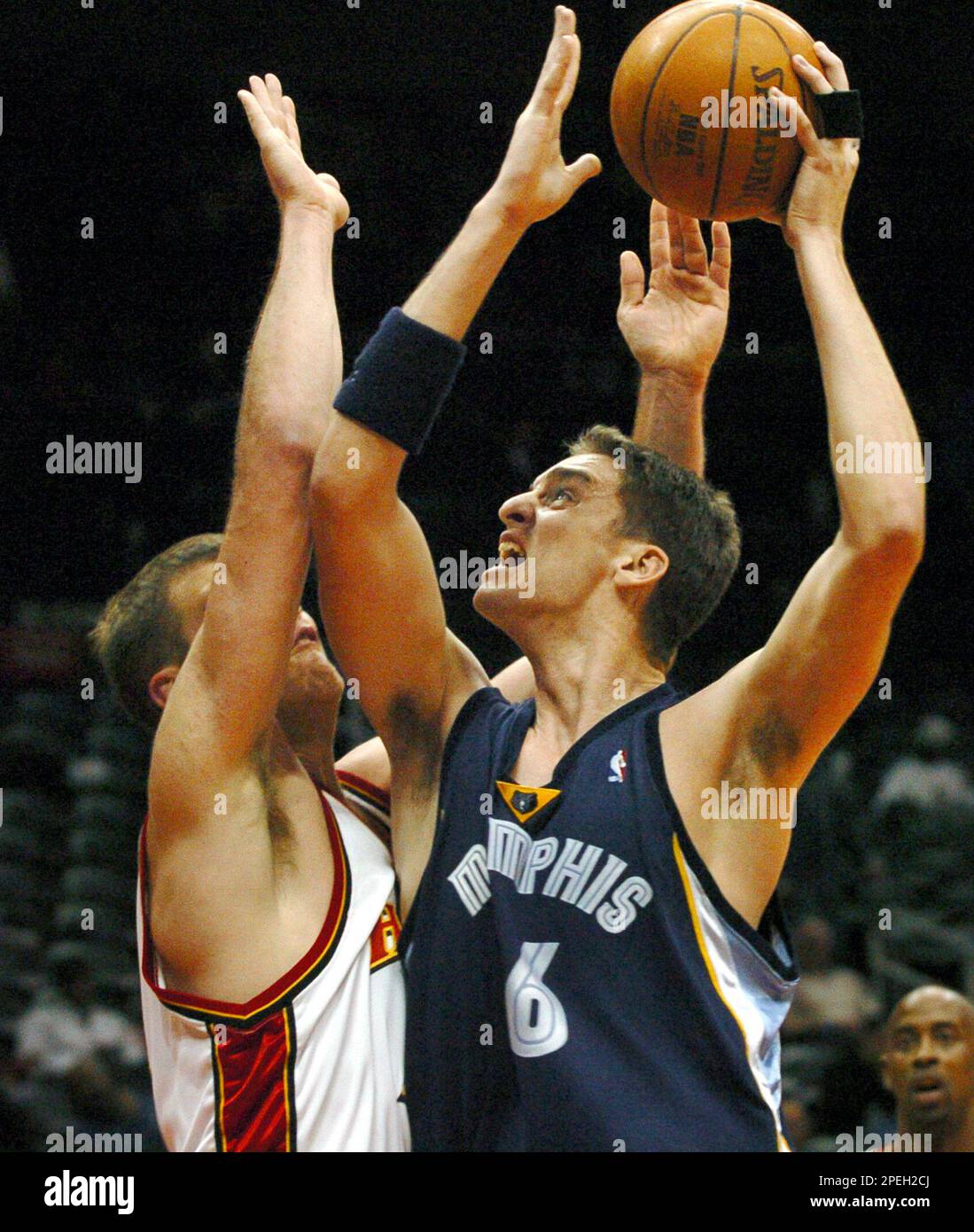 Memphis Grizzlies forward Pau Gasol (16) of Spain, goes to the net against  Atlanta Hawks forward Jason Collier, left, during the first quarter,  Wednesday, Dec. 8, 2004, at Philips Arena in Atlanta. (