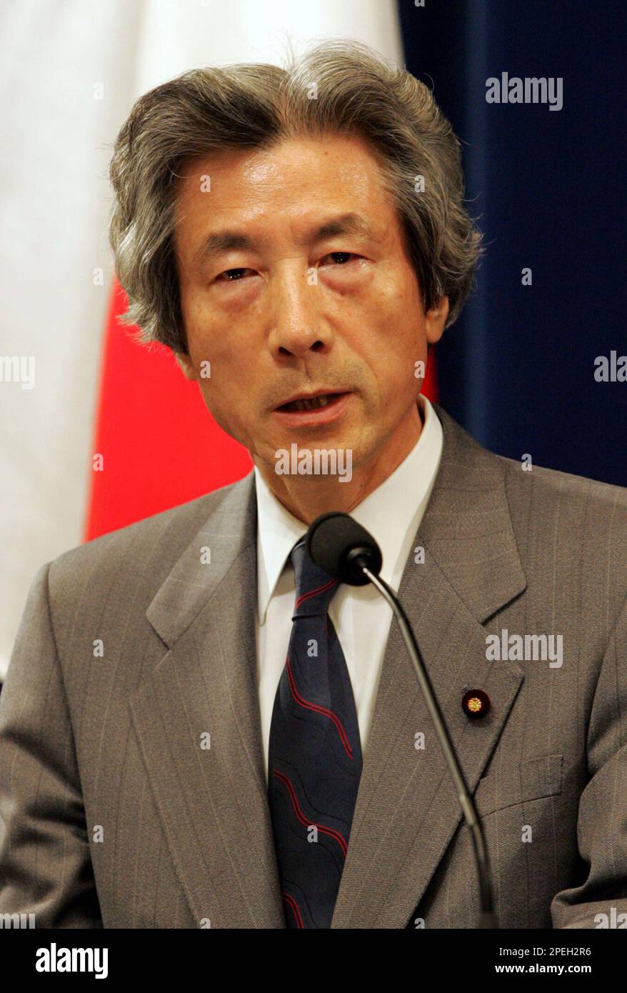 Japanese Prime Minister Junichiro Koizumi speaks during a press conference at his official residence in Tokyo Thursday, Dec. 9, 2004 after Japan's Cabinet voted to keep Japanese troops in Iraq for another year, extending the country's largest overseas military operation since the end of World War II. "We must not give in to terror," Koizmi said in the nationally televised address. "The Iraqis are trying to build a government with their own hands. We must support this. The Self-Defense Forces are needed for this end." (AP Photo/Shizuo Kambayashi) Stock Photo