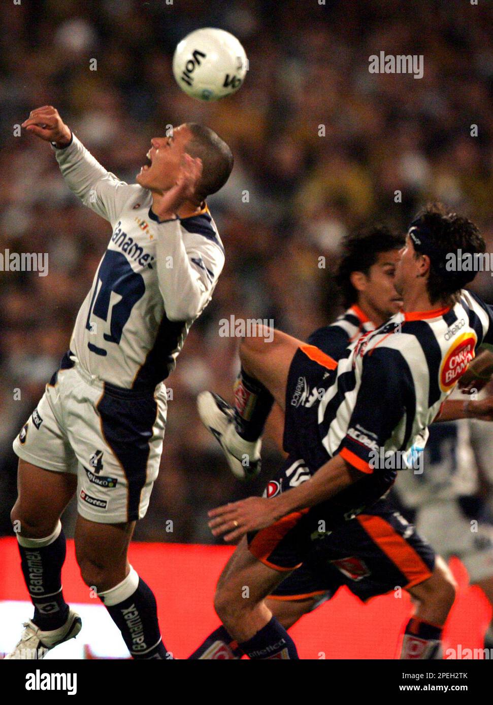 Dario Veron, left, of Pumas, fights to head the ball against Guillermo  Franco of Monterrey during the first game of the Mexican soccer championship  final at the University Stadium in Mexico City