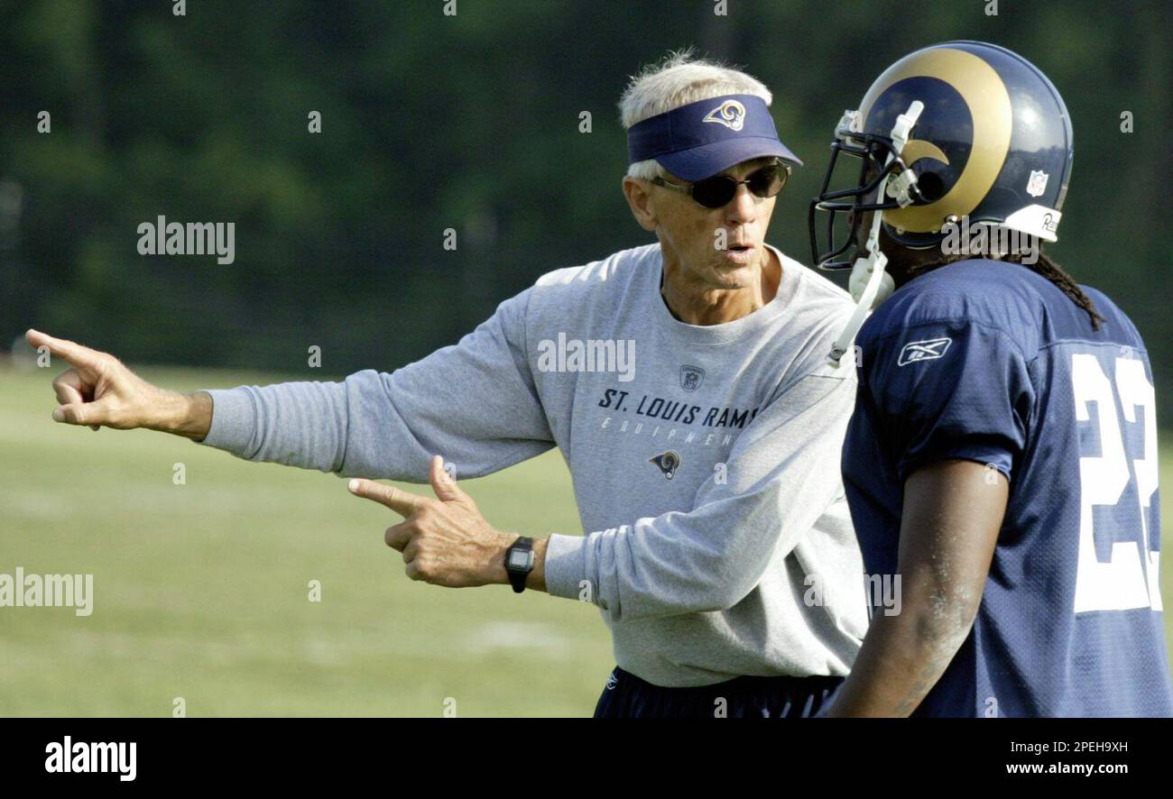 FILE ** Larry Marmie, St. Louis Rams defensive coordinator works with Travis Fisher during the team's summer training camp in Macomb, Ill. Saturday, July 31, 2004. Rams head coach believes that
