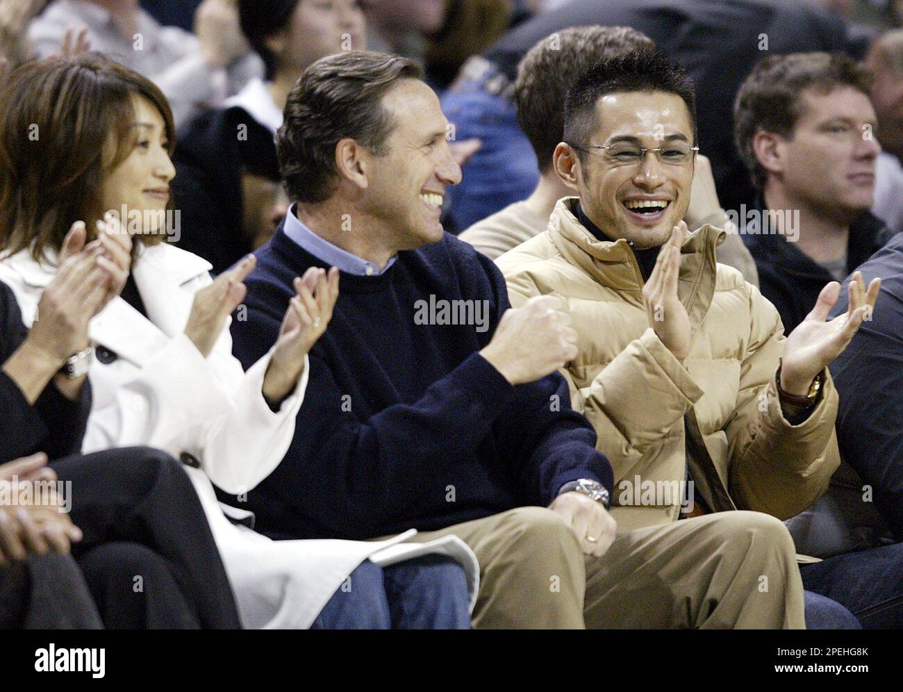 Former Seattle Mariners' Ichiro Suzuki, his wife Yumiko Fukushima, right,  and Ken Griffey Jr., left, sit behind a plaque during the induction  ceremony for Suzuki into the Mariners Hall of Fame during