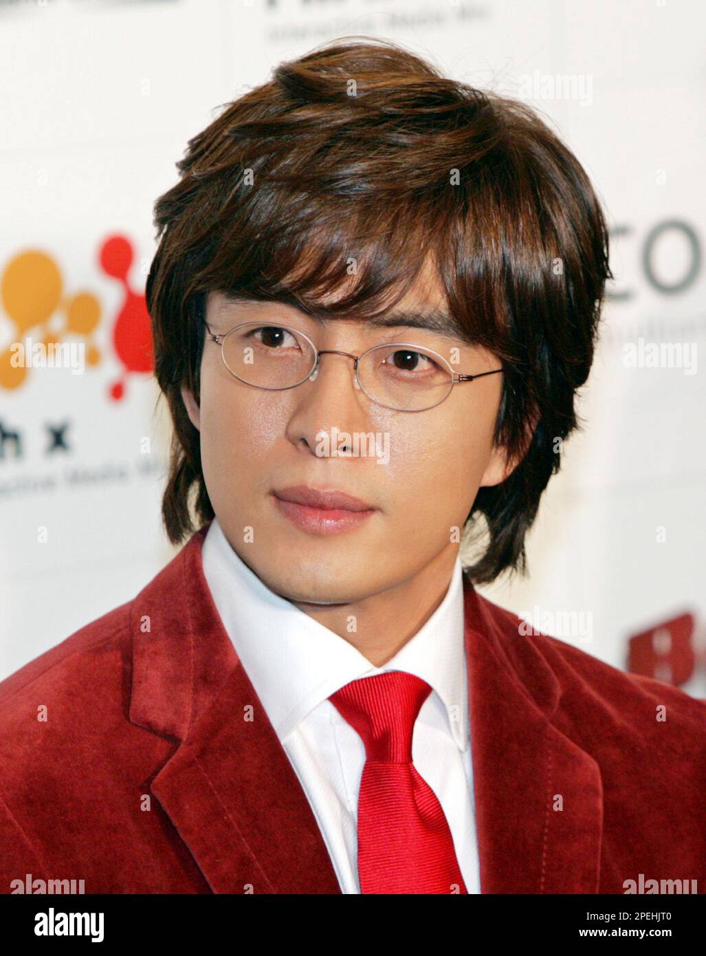 South Korean actor Bae Yong-joon appears before opening his photo exhibition in Tokyo Friday, Nov. 26, 2004. Bae, a main actor of the mega-hit South Korean soap opera "Winter Sonata," apologized to the media and canceled some of his engagements for the day after learning ten of his fans were slightly injured earlier in the day in a jostling incident when his car was leaving a Tokyo hotel. The 32-year-old star arrived in Japan Thursday to attend the opening of the exhibition held in commemoration of the release of his photo collection in Japan. (AP Photo/Katsumi Kasahara) **EDITORIAL USE ONLY,  Stock Photo