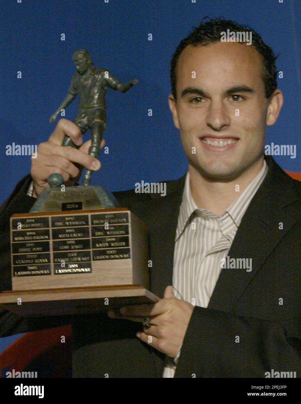 San Jose Earthquakes player Landon Donovan, holds the trophy after