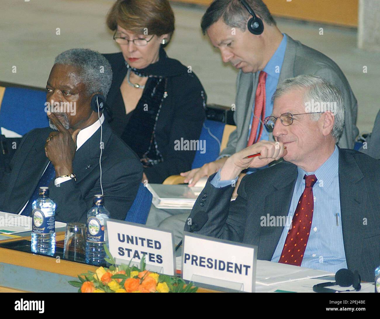 United Nations Secretary General, Kofi Annan, left, and USA Ambassador to the United Nations, John Danforth, right, listen as John Garang, Chairman Sudan Peoples Liberation Army (not in picture), speaks during the opening of the UN Security Council Meeting in Nairobi, Kenya, Thursday, Nov.18, 2004. (AP Photo/Sayyid Azim) Stock Photo