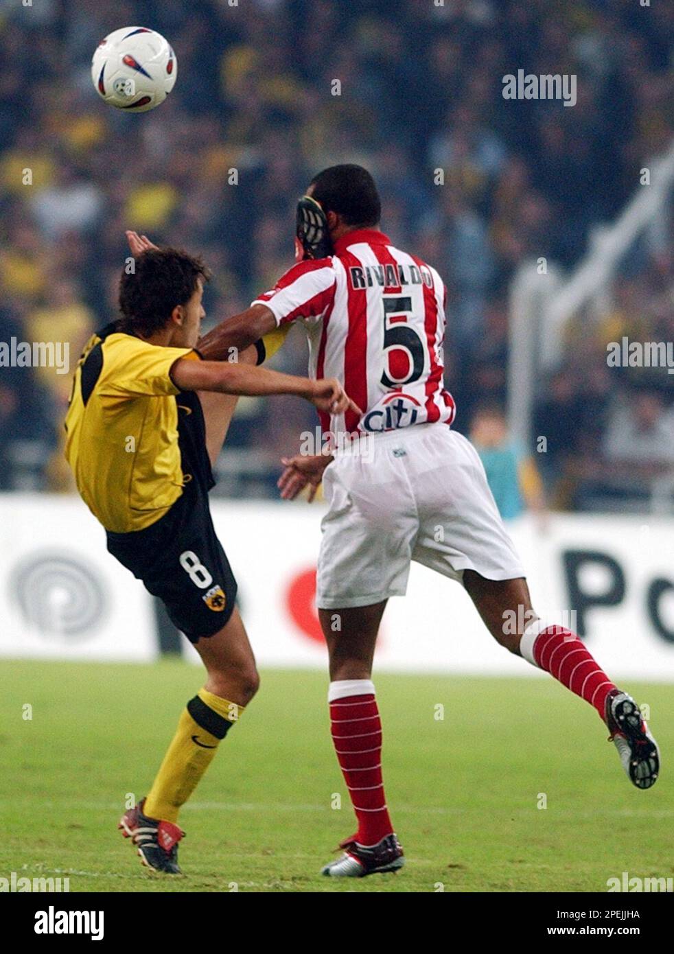 Bulgarian Ivan Rusev of AEK Athens, left, stops Brazilian Rivaldo of  Olympiakos during a Greek first division soccer league match at the Olympic  stadium of Athens on Sunday, Nov. 7, 2004. The