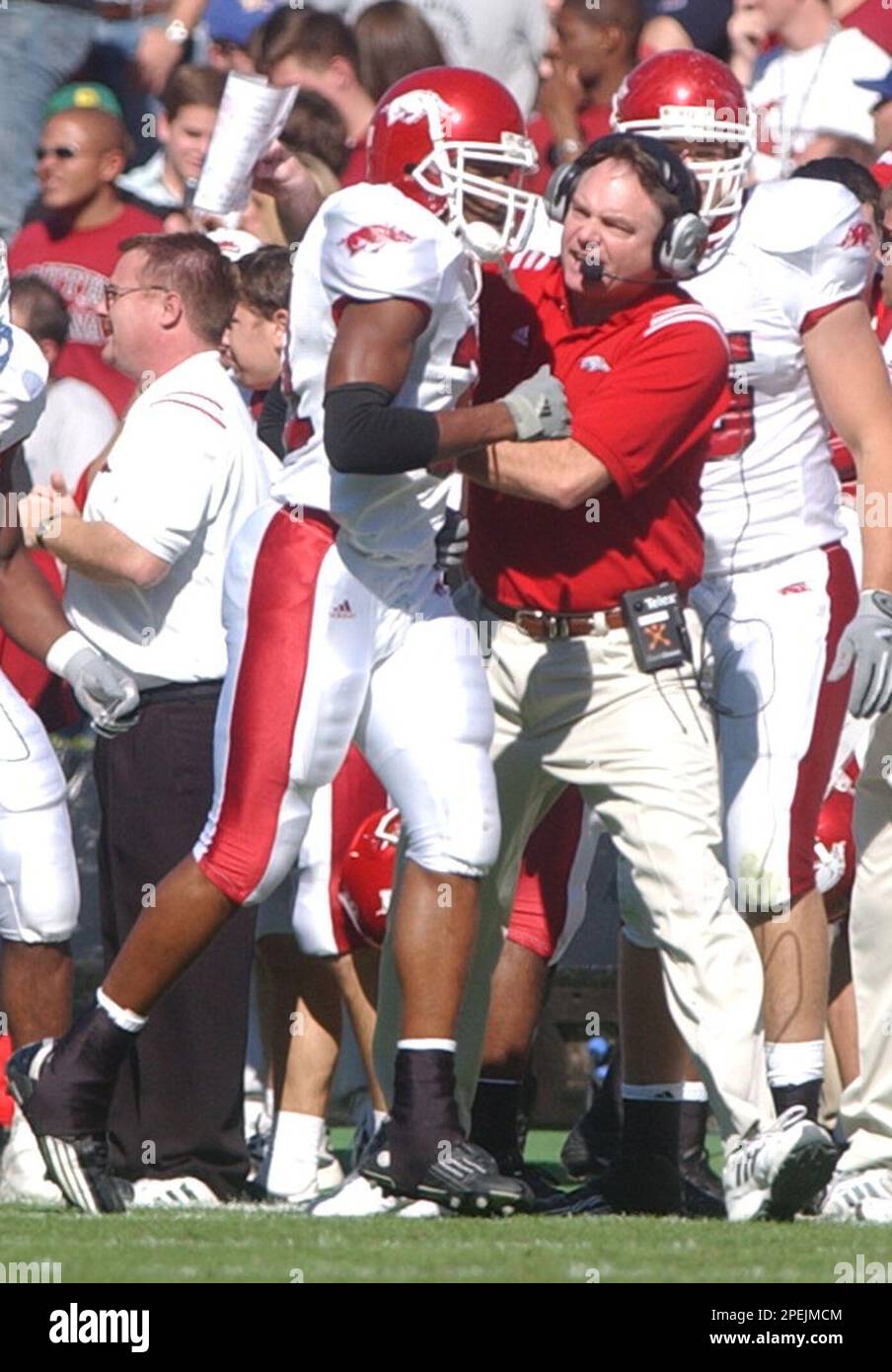 Arkansas coach Houston Nutt, right, celebrates with his player Vickiel