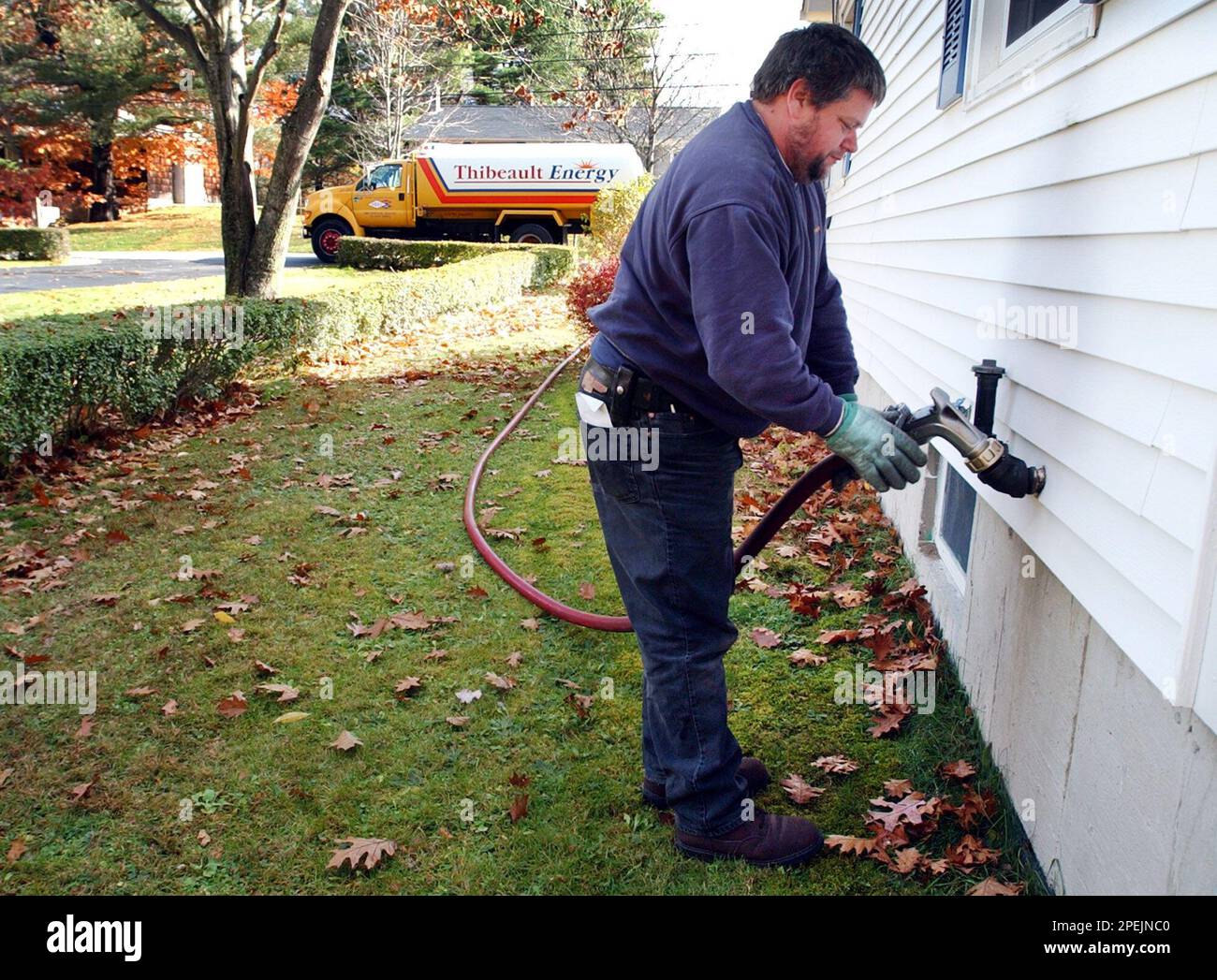 Heating oil deliveryman Charlie Thurlow fills a tank at a home in Topsham,  Maine, Friday, Nov. 5, 2004. The average price of No. 2 heating oil in New  England recently surpassed the