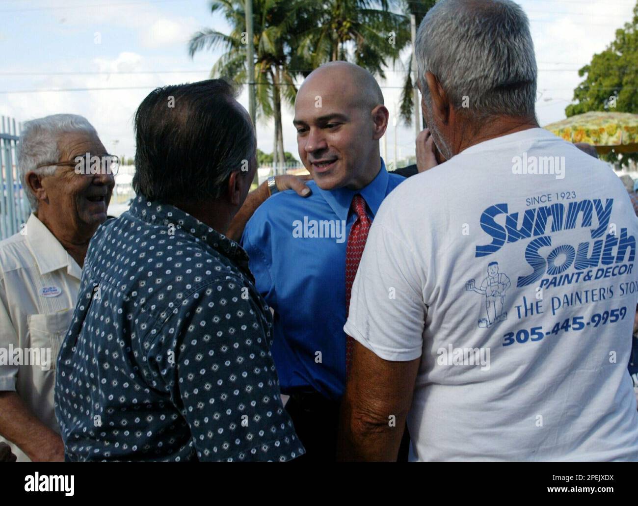 Al Milian, center, Republican candidate for public defender in Miami