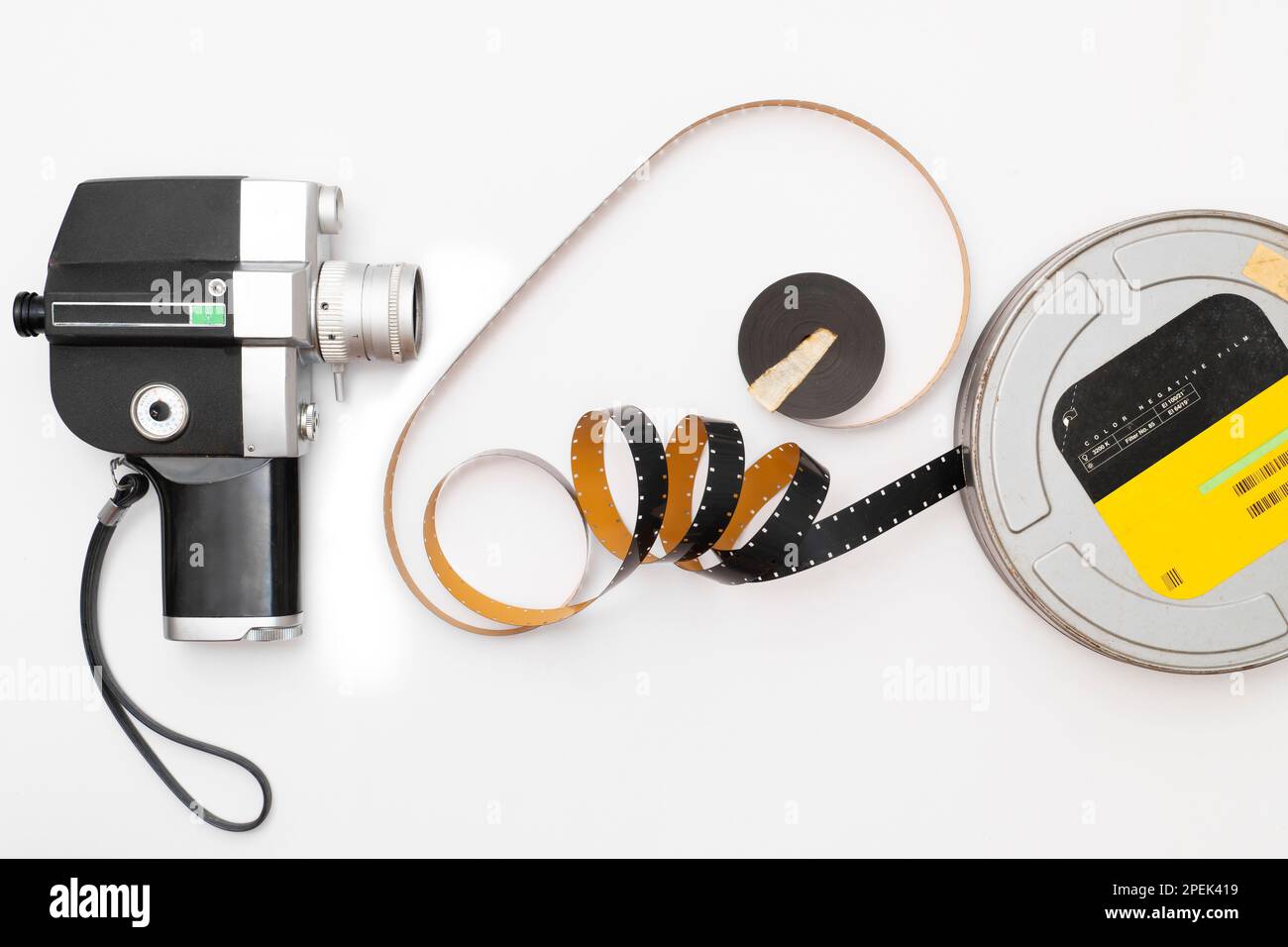 old 8mm film camera and film roll on white background Stock Photo Alamy