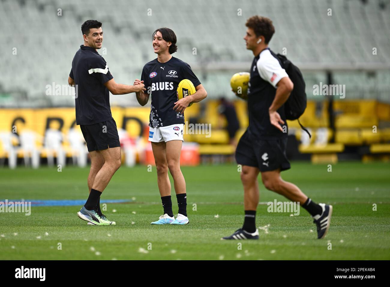 Oliver Hollands of Carlton (centre) warms up ahead of the AFL Round 1 ...