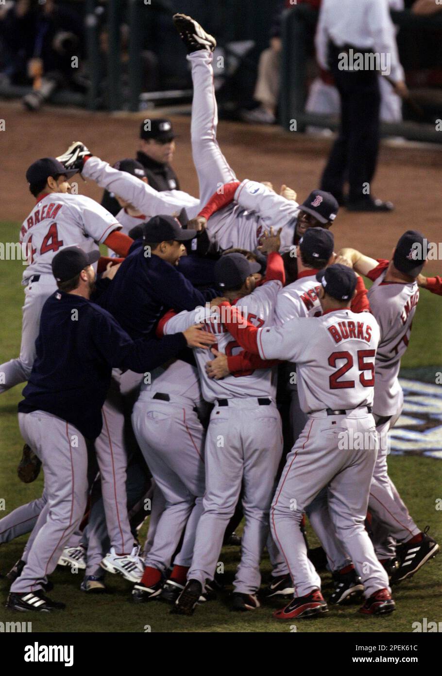 Boston Red Sox Pokey Reese jumps on top of his teammates after the Red Sox  defeated the St. Louis Caridnals 3-0 in Game 4 to win the World Series at  Busch Stadium