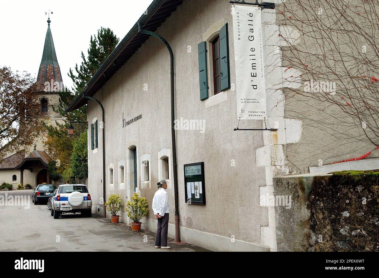 An unidentified woman looks at the entrance of the Fondation Neumann in the  castle of Gingins, southwestern Switzerland, Wednesday, Oct. 27, 2004.  Fifteen vases by French artist Emile Galle (1846 - 1904)