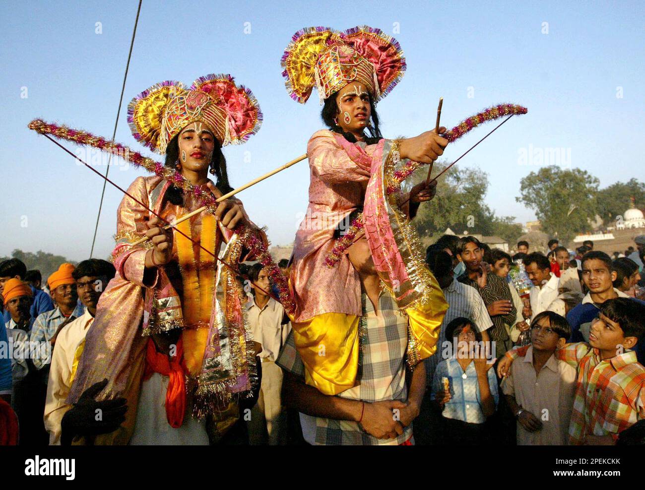 Children dressed as Hindu God Rama, left, and his brother Laxman sit on ...