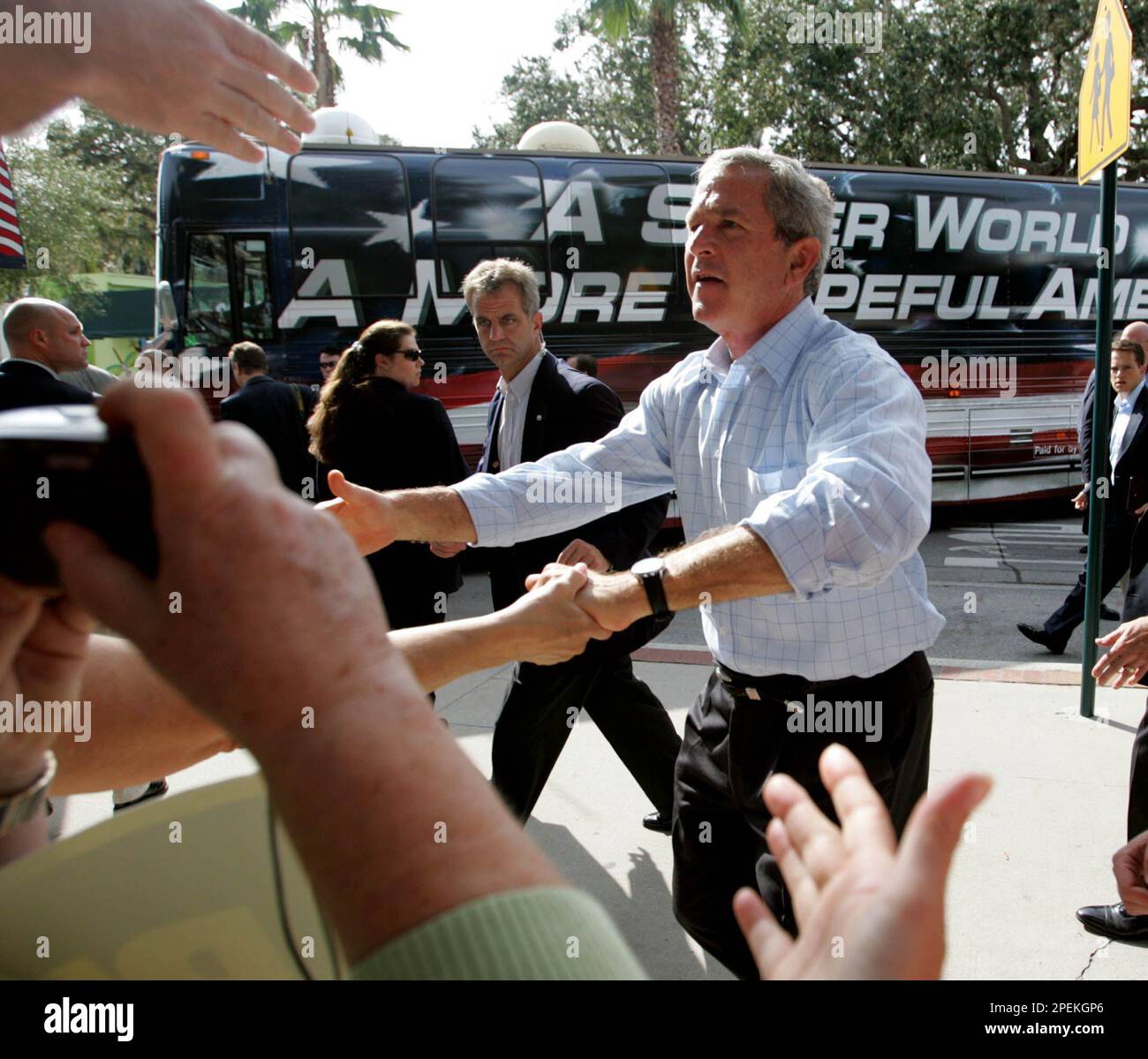 President Bush stops to greet supporters outside Paradise Restaurant ...