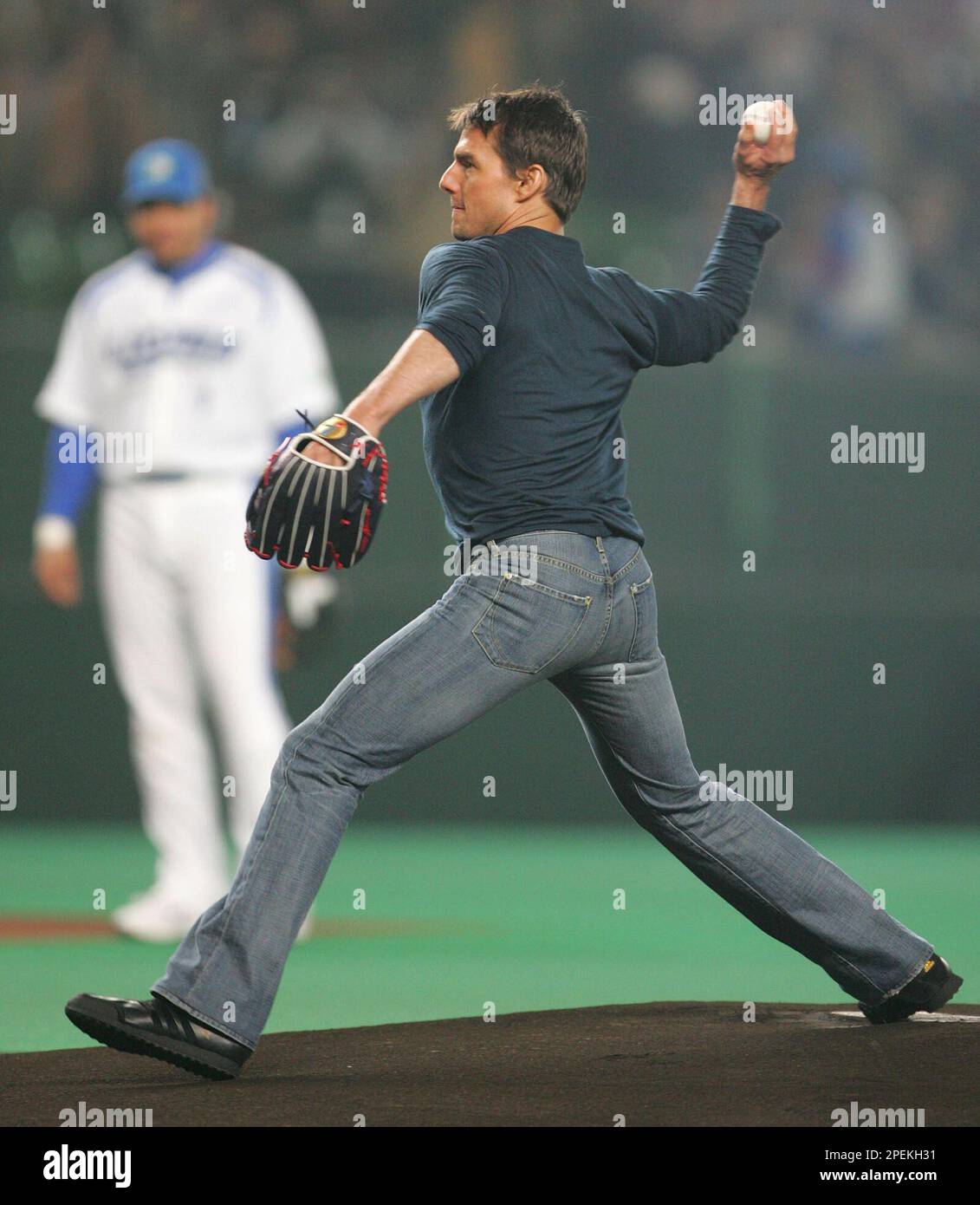 Tom Cruise throws the ceremonial first pitch for the Game 3 of the best-of-seven Japan Series between the Pacific League champion Seibu Lions and its Central League counterpart Chunichi Dragons at Seibu