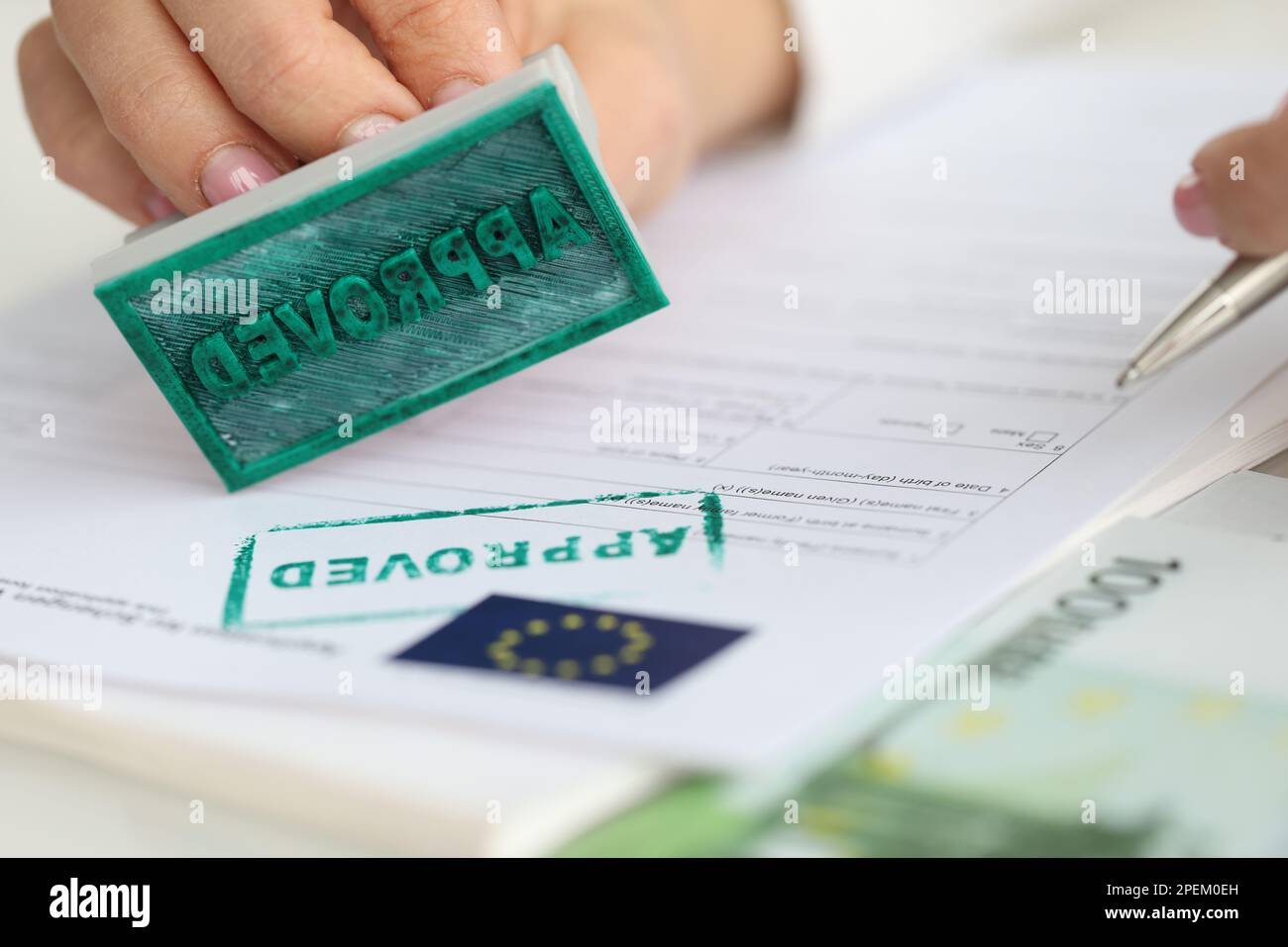 EU Schengen visa application and stamp approved document Stock Photo