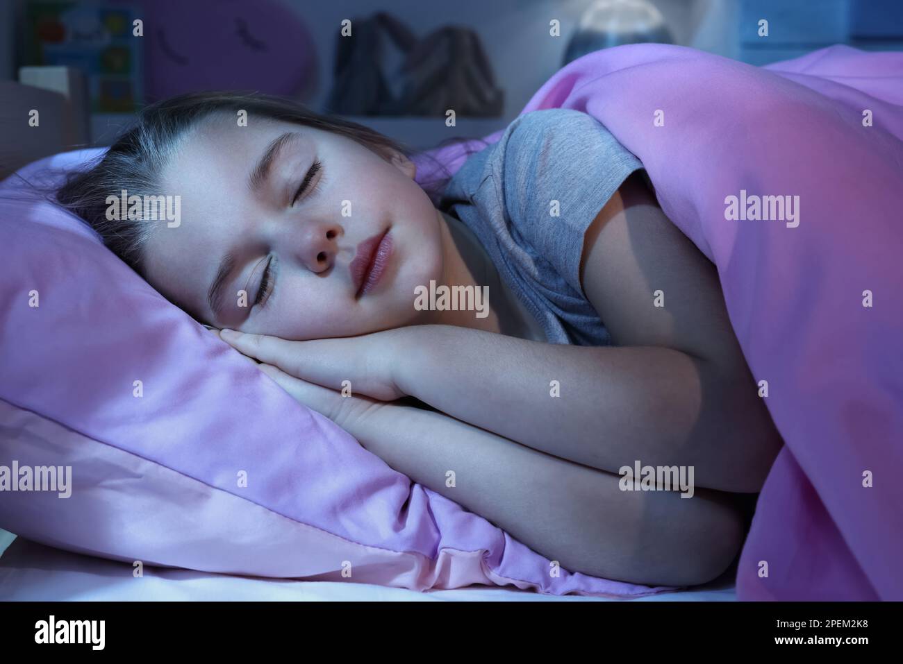 Cute little girl sleeping in bed at home Stock Photo - Alamy
