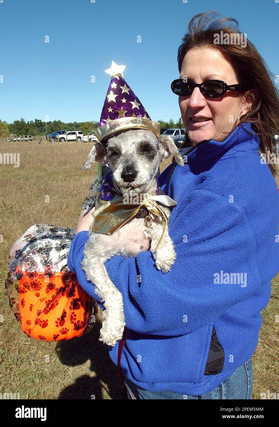 Michele Carlin, of Ferndale, Mich., holding her dog "Bubbles", won