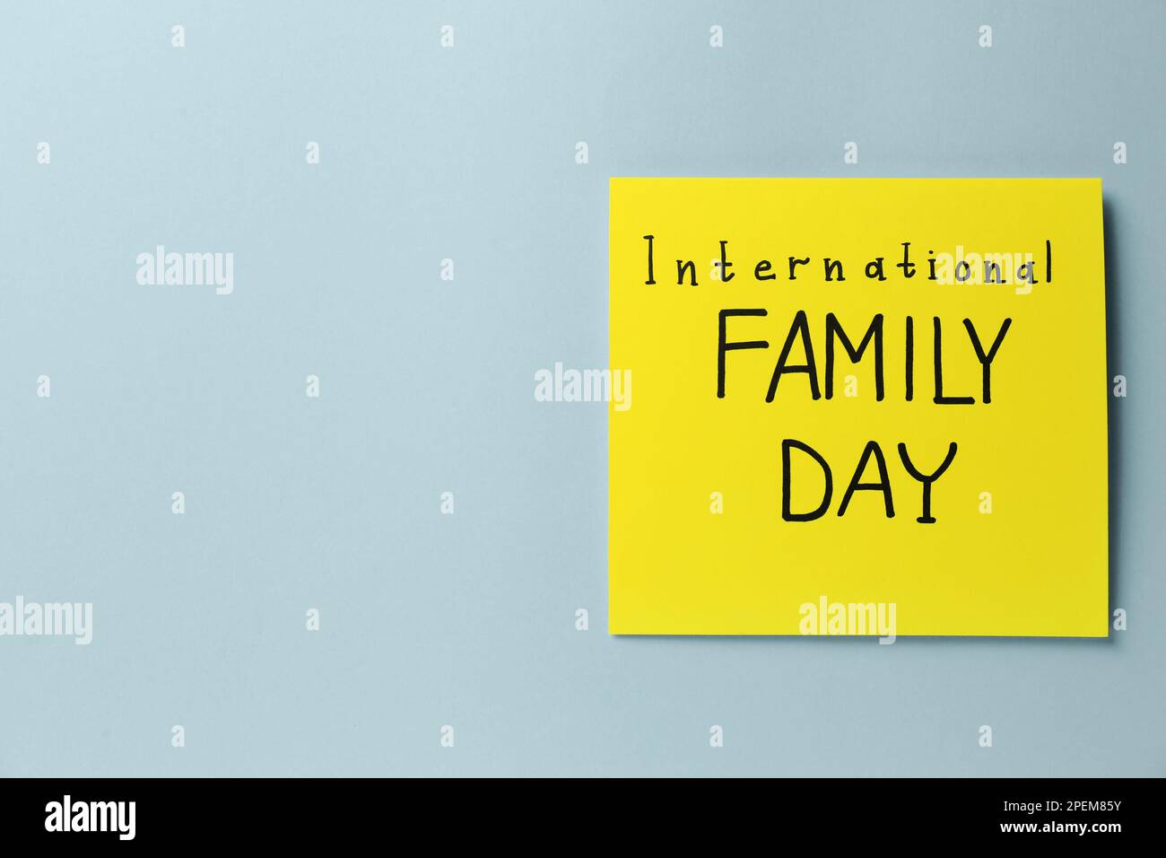 Card with words International Family Day on grey background, top view. Space for text Stock Photo