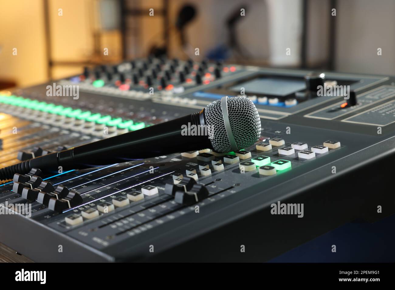 Microphone on professional mixing console in radio studio Stock Photo
