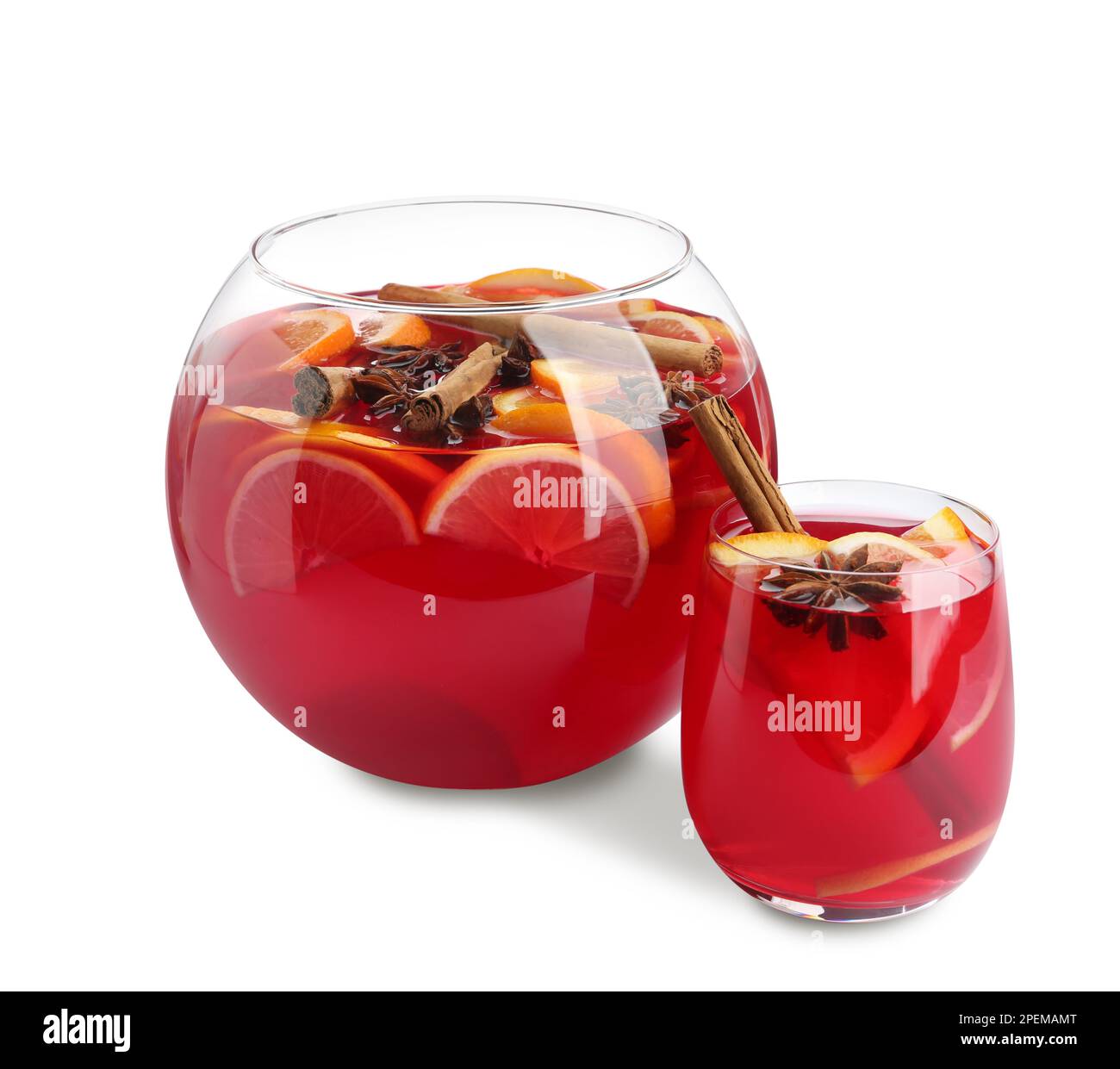 Glass and bowl of delicious aromatic punch drink on white background ...