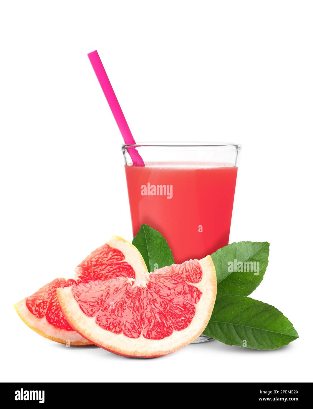 Glass of grapefruit juice, fresh fruit and green leaves on white