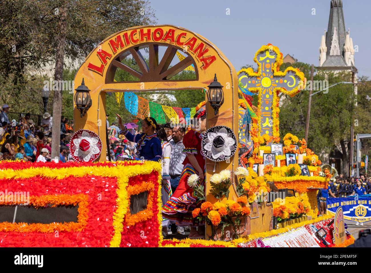 San Antonio, Texas, USA - April 8, 2022: The Battle of the Flowers Parade, Float Tittled la Michoacana carries people wearing mexican traditional clot Stock Photo