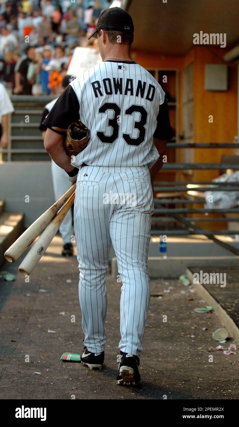Chicago White Sox's Aaron Rowand walks with his bats as he is one of the  last players to leave the dugout following the White Sox's final home game  of the year Sunday