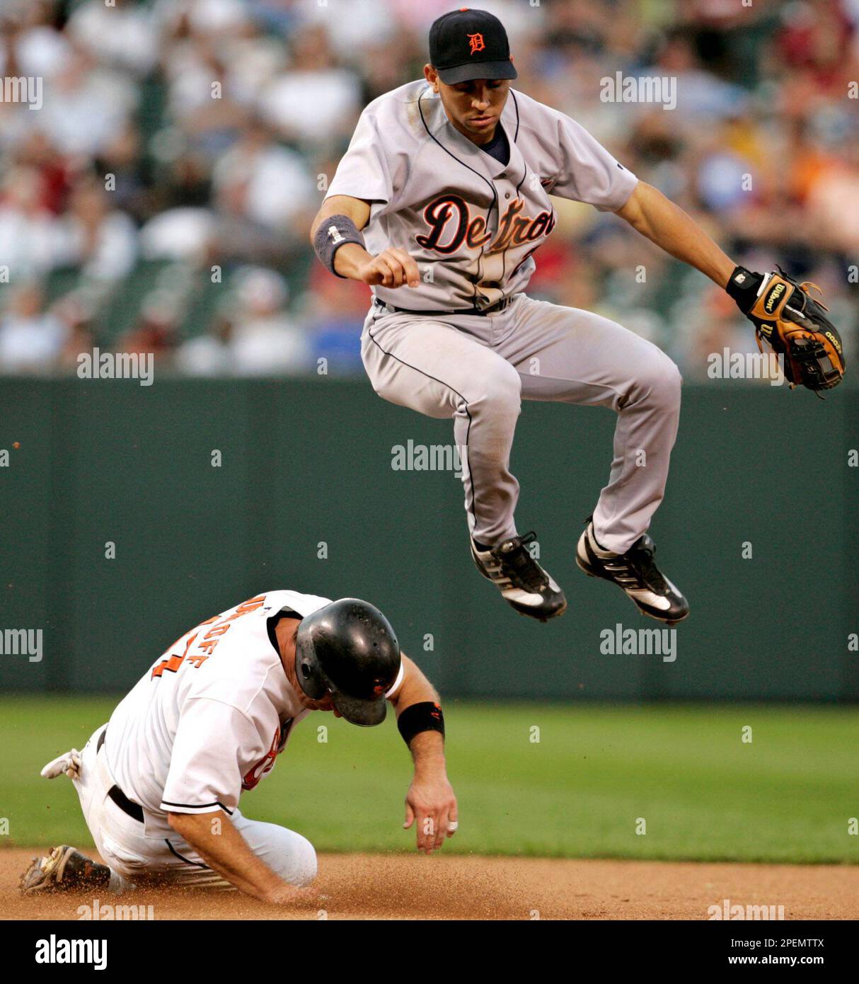 Baltimore Orioles' B.J. Surhoff, bottom, is forced out by Detroit Tigers  shortstop Ormar Infante during the seventh inning Saturday, Sept. 25, 2004,  in Baltimore. Larry Bigbie was safe at first. The Orioles