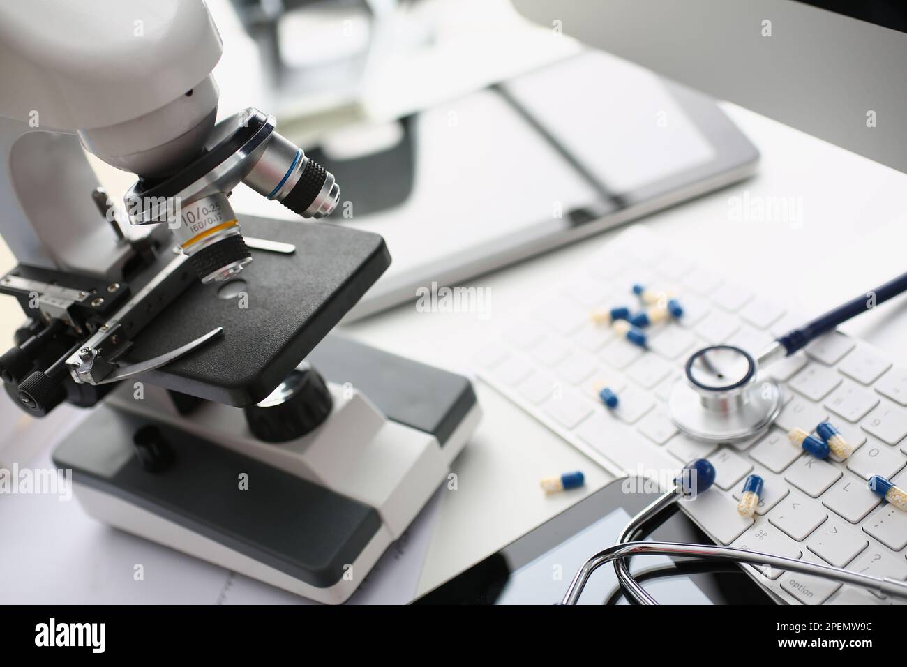 Tablets stethoscope and microscope with keyboard in laboratory Stock ...