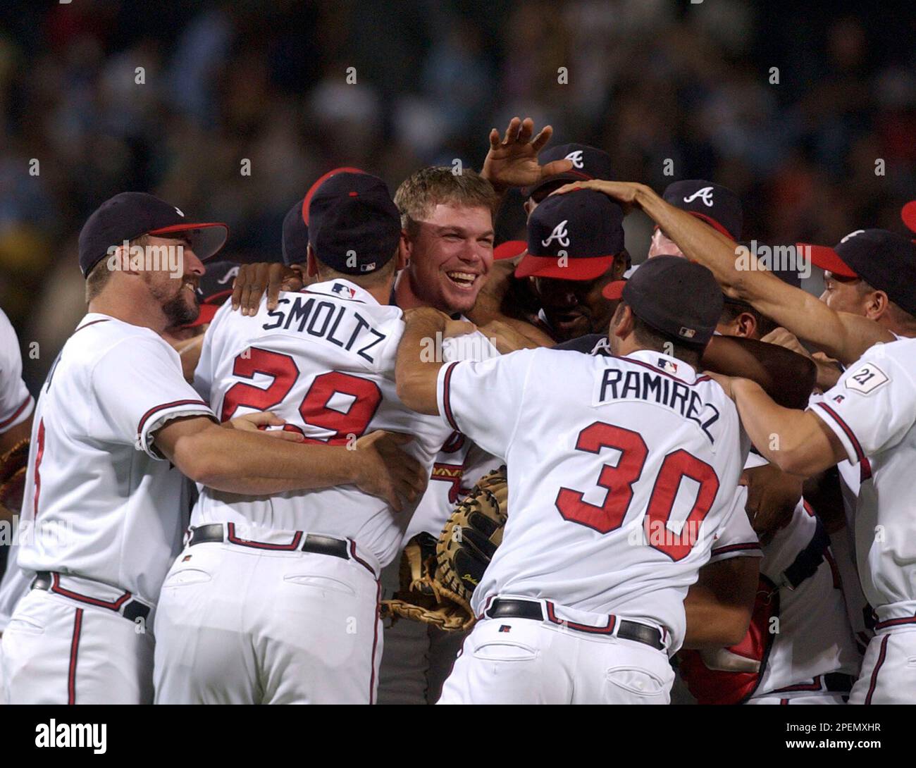 Atlanta Braves' Chipper Jones, right, celebrates with teammate