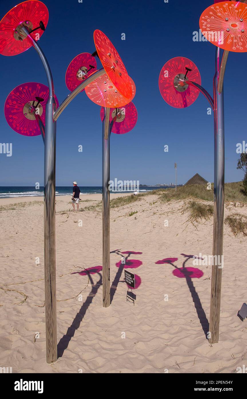 Sculpture with pink discs by Lisa Sorbie Martin (Stillness in Time), Currumbin beach, Swell festival, 2016. Gold Coast, Australia. Sun and sand. Stock Photo