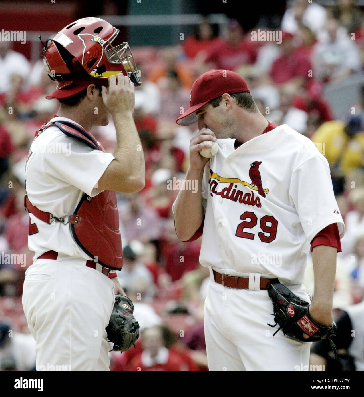 St. Louis Cardinals catcher Mike Matheny, left, and starting pitcher Chris  Carpenter (29) confer on the mound in the fourth inning against the Arizona  Diamondbacks, Saturday, Sept. 18, 2004, in St. Louis.