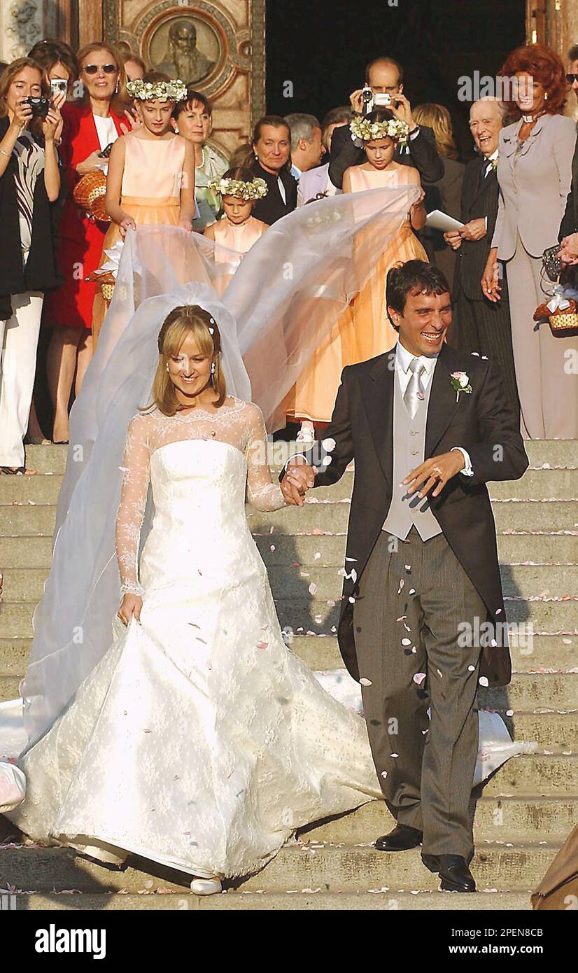 Newly-wed Italian conductor Carlo Ponti Jr., right, and his wife, Hungarian  violinist Andrea Meszaros, walk down the steps of the St. Stephen Basilica  in Budapest, on Saturday Sept., 18, 2004, after their