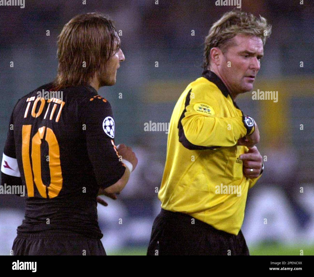 AS Roma Francesco Totti, left, argues with Swedish Referee Anders Frisk as he puts his hands to his side pocket during the Group B, Champions League soccer match between Dinamo Kiev and Roma in Rome's Olympic stadium, Wednesday, Sept. 15, 2004. (AP Photo/Giuseppe Calzuola) Stock Photo