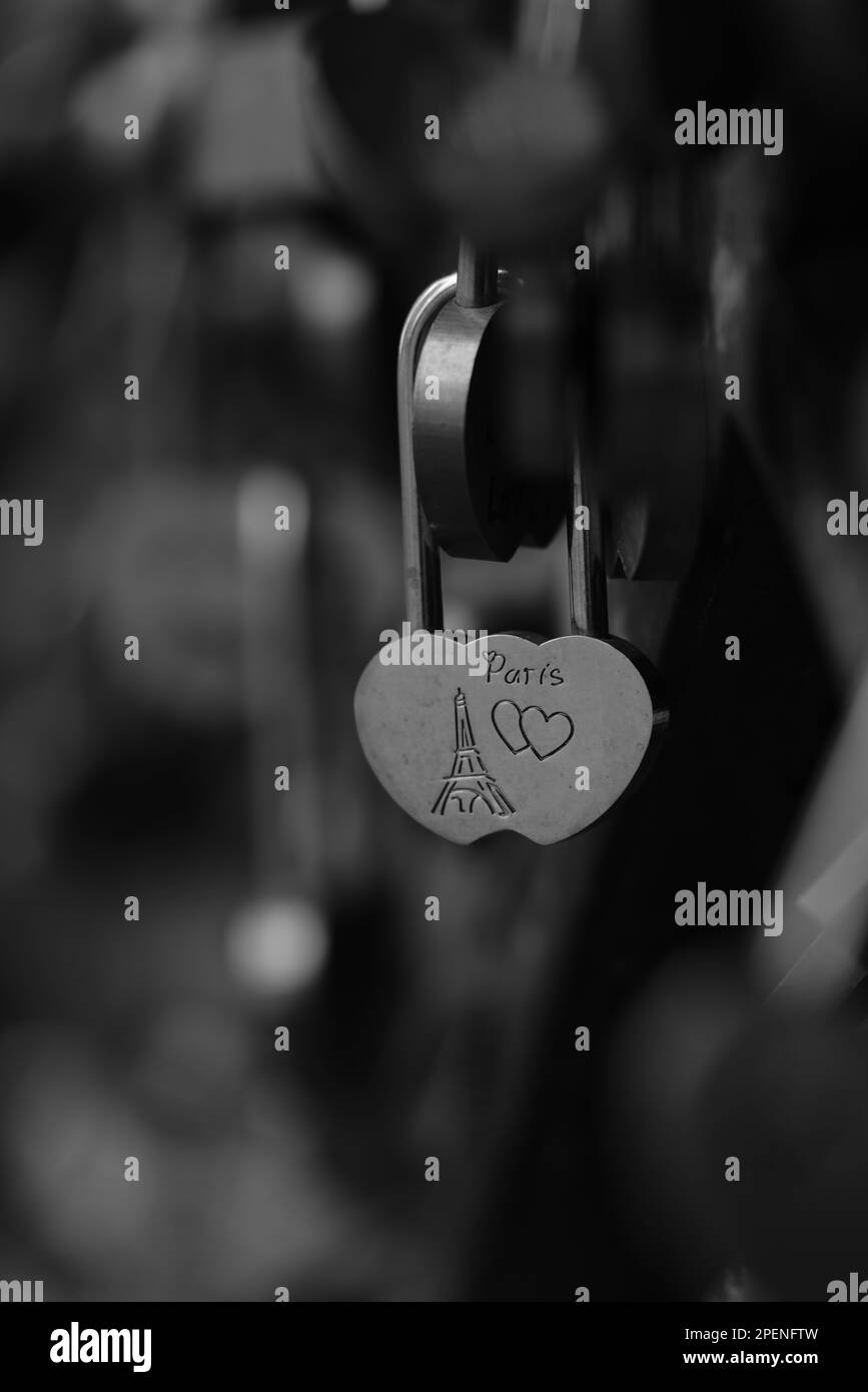 A close up shot of a love padlock written in a handwritten font with a ...