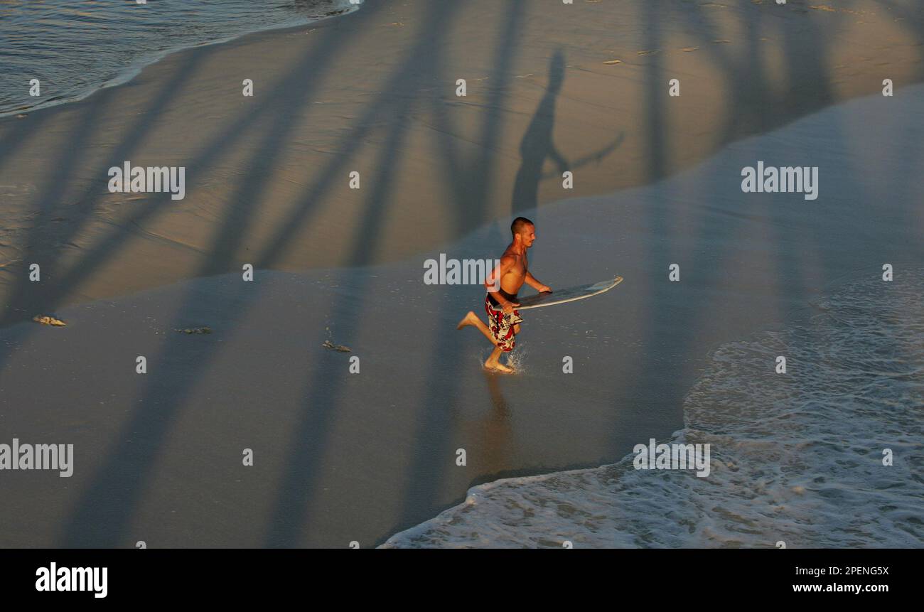 Gary Fisk of Panama City, plays in the surf at Panama City Beach, Fla.,  Monday, Sept. 13, 2004. With Hurricane Ivan expected to hit the Florida  panhandle later this week, Panama City