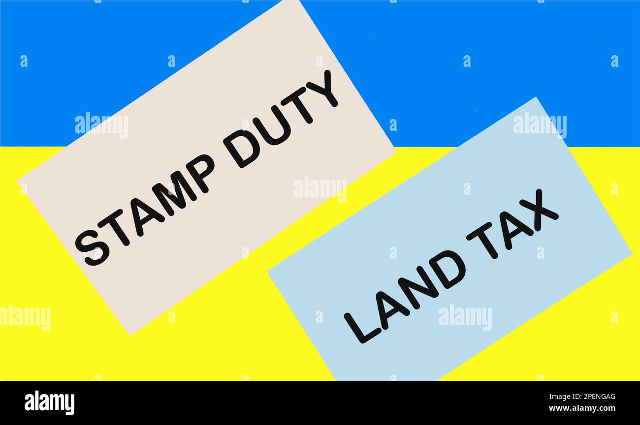 SDLT - Stamp duty for land tax is written on the card against a blue ...