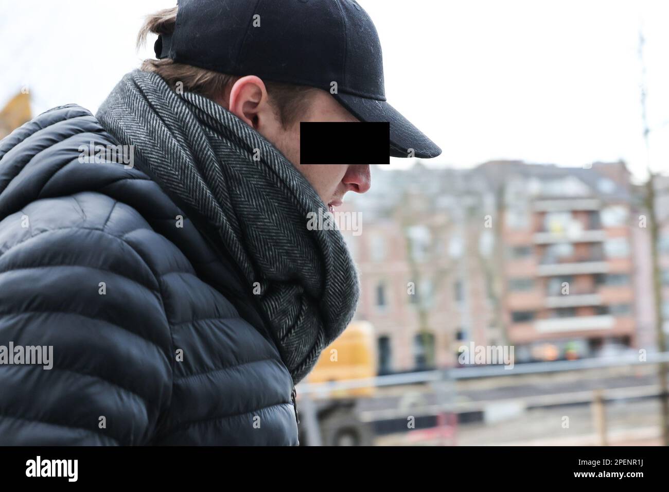 One of the accused arrives for a session of the case before the Antwerp