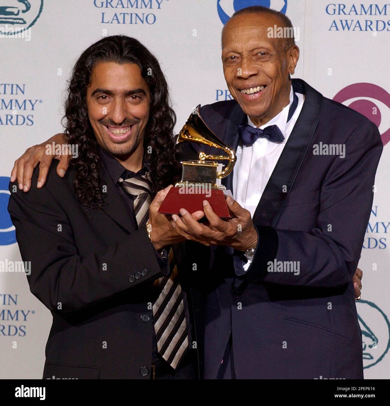 Diego El Cigala, left, and Bebo Valdes hold their award for Best  Traditional Tropical Album at the 5th Annual Latin Grammy Awards in Los  Angeles, Wednesday, Sept. 1, 2004. (AP Photo/Reed Saxon