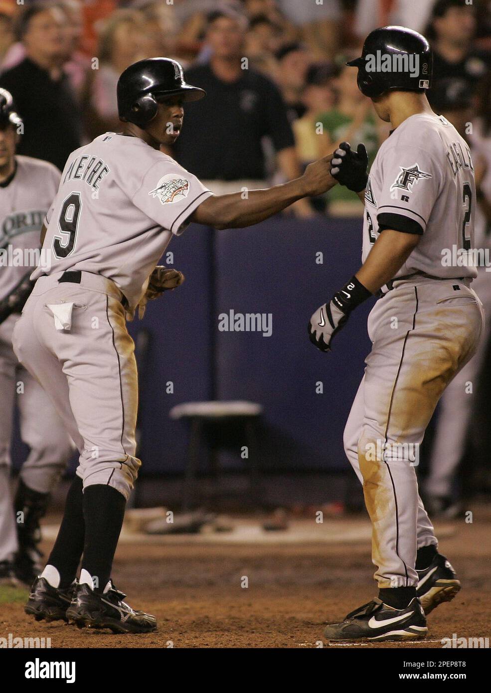 Florida Marlins' Juan Pierre scores on a Damion Easley base hit as