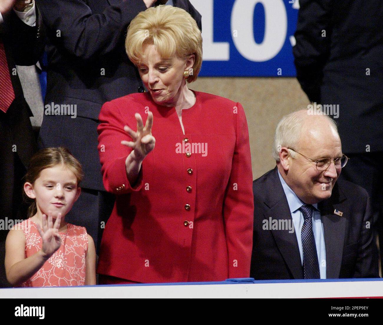 Lynne Cheney, center, shows her granddaughter how to signify &ldquo;four more