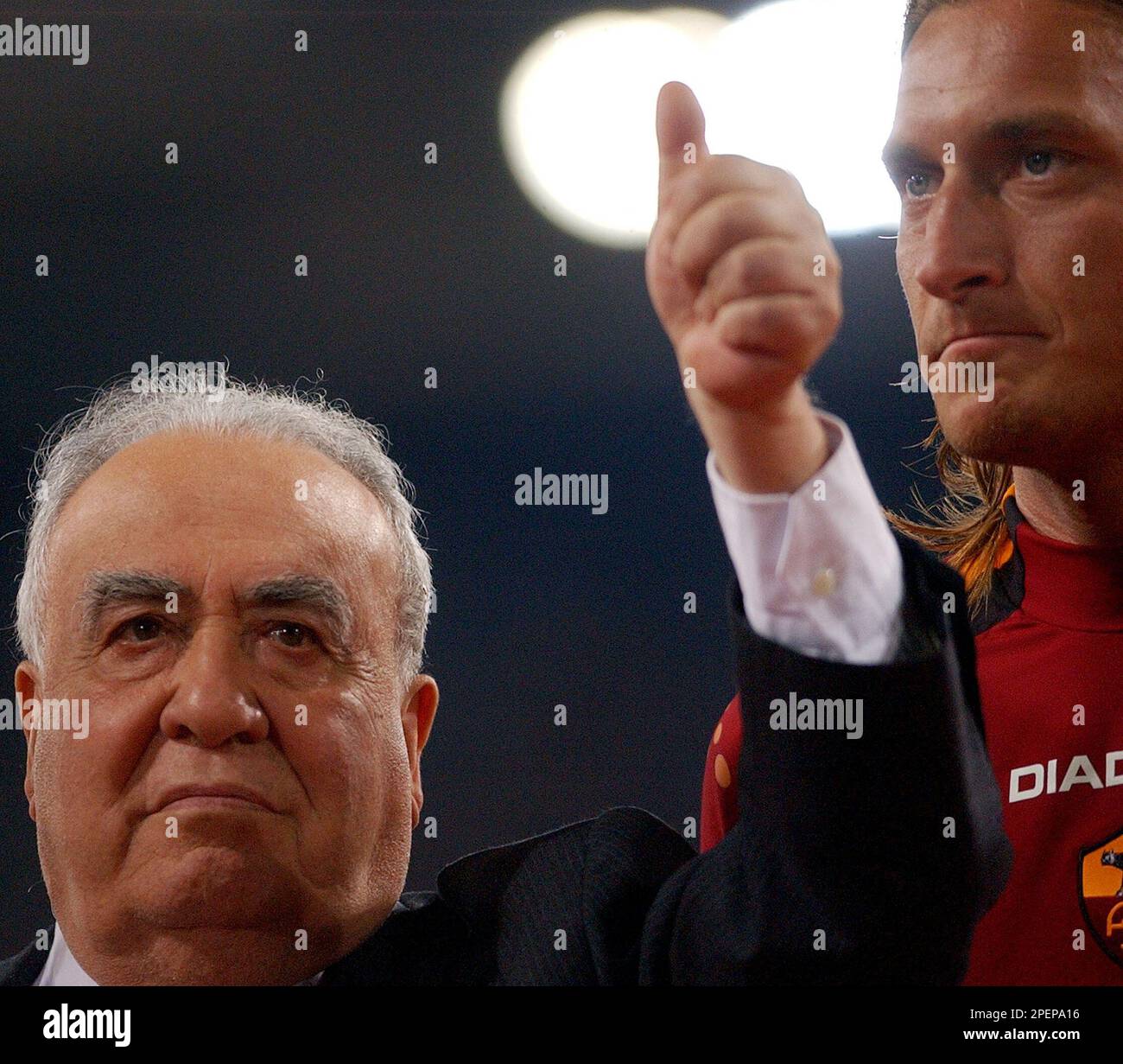 AS Roma President Franco Sensi, flanked by Francesco Totti, gives the ...