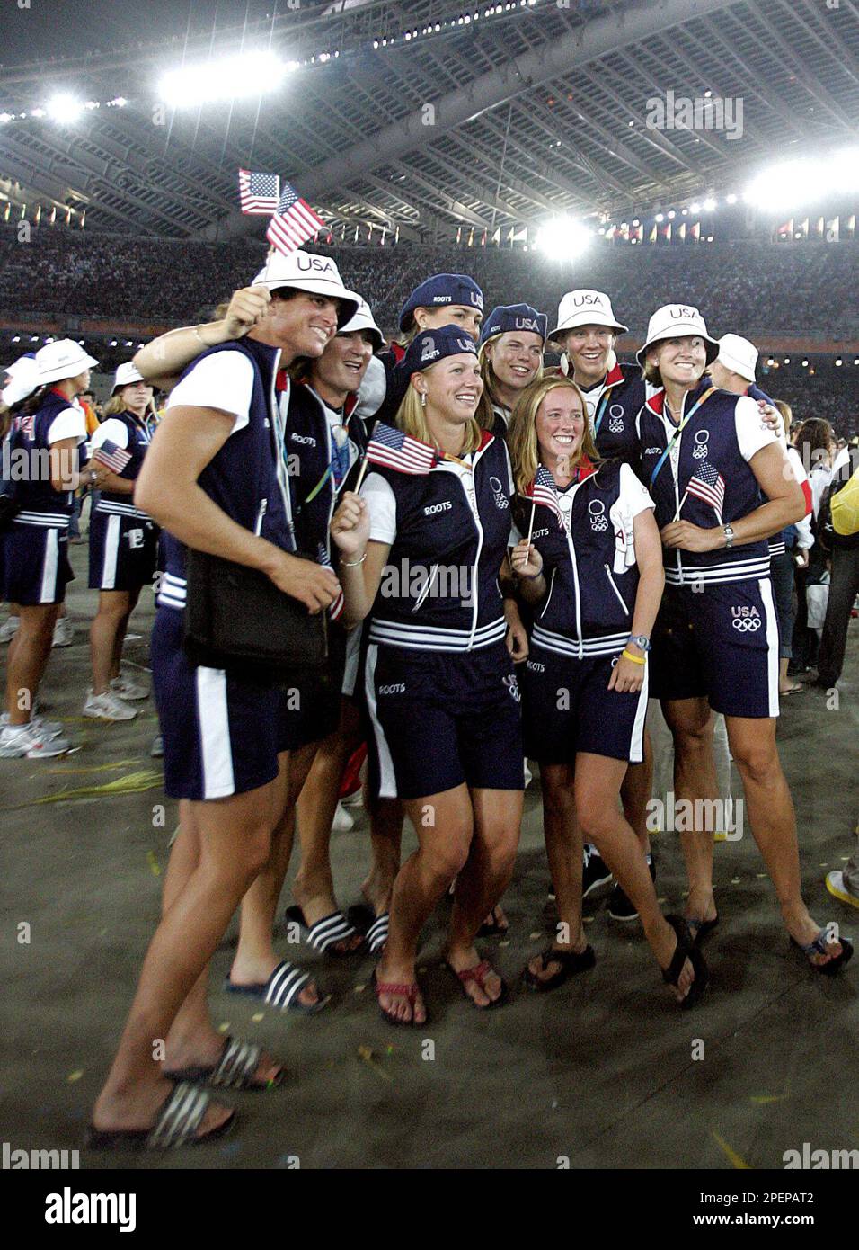 U.S. athletes pose for a photo during the closing ceremony of the 2004